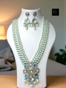 High Quality Mossainite AD Polki Kundan Fusion Style Maala Necklace 
✨ Elegant. Regal. Timeless. ✨
This handcrafted pearl and aqua stone necklace set is designed to make every moment feel royal. Perfect for weddings, festive occasions, or when you just want to feel extraordinary. 💫
